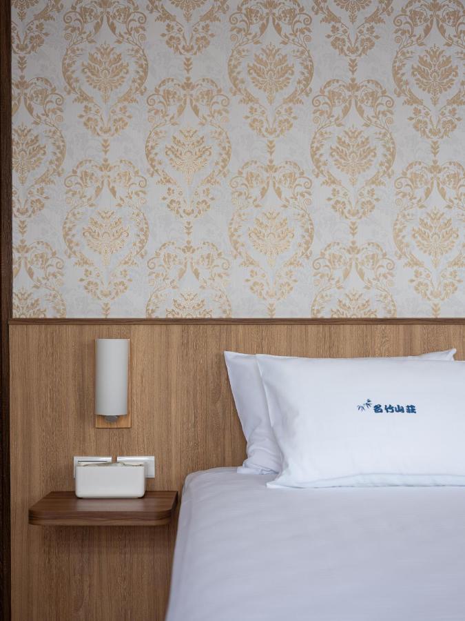 לוגו 名竹旅社 Minzu Hotel מראה חיצוני תמונה